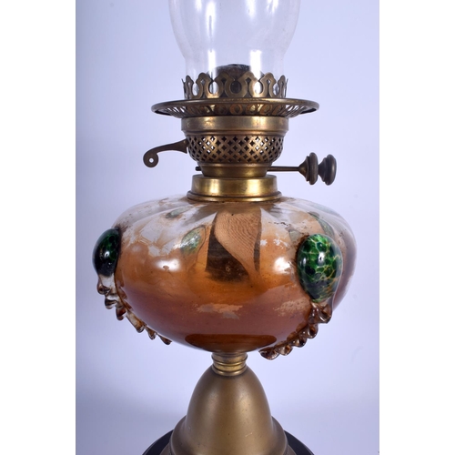 330 - A LARGE ART NOUVEAU SMOKEY GLASS OIL LAMP overlaid with speckled green motifs. 37 cm high not inc fu... 