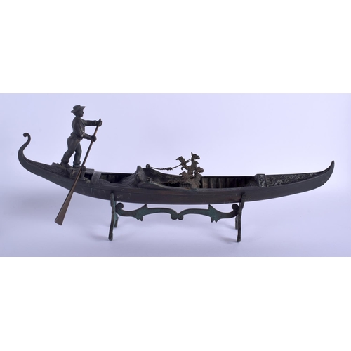 343 - A RARE ANTIQUE VENETIAN ITALIAN BRONZE FIGURE OF A GONDOLA decorated with flowers. 48 cm x 23 cm.