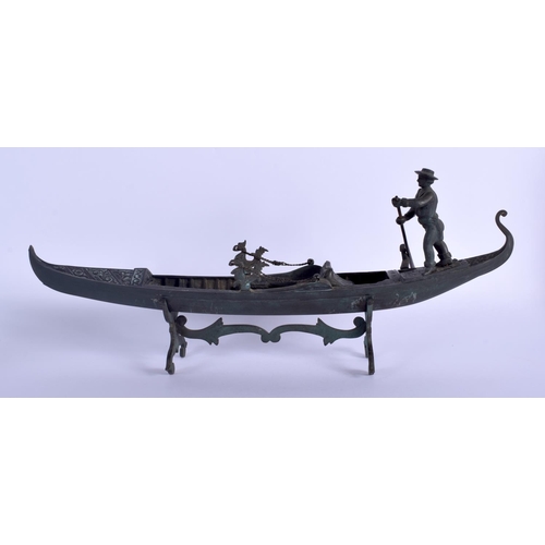 343 - A RARE ANTIQUE VENETIAN ITALIAN BRONZE FIGURE OF A GONDOLA decorated with flowers. 48 cm x 23 cm.