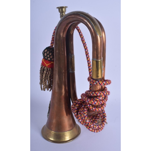 344 - A MILITARY ARGYLE & SUTHERLAND COPPER AND BRASS BUGLE. 28 cm wide.