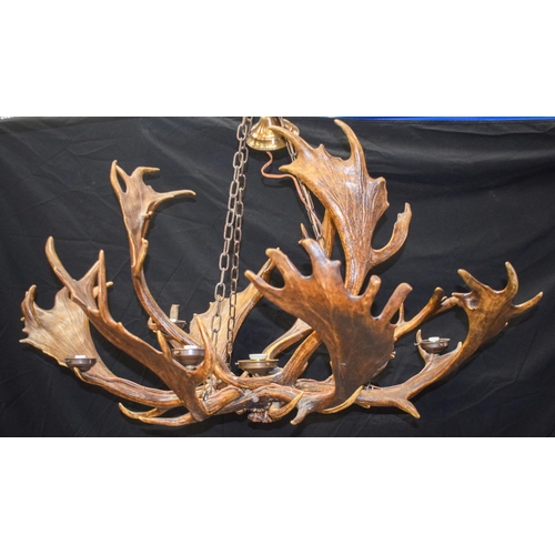 347 - A LOVELY MATCHED PAIR OF EARLY 20TH CENTURY ANTLER CHANDELIER of naturalistic form, probably formed ... 