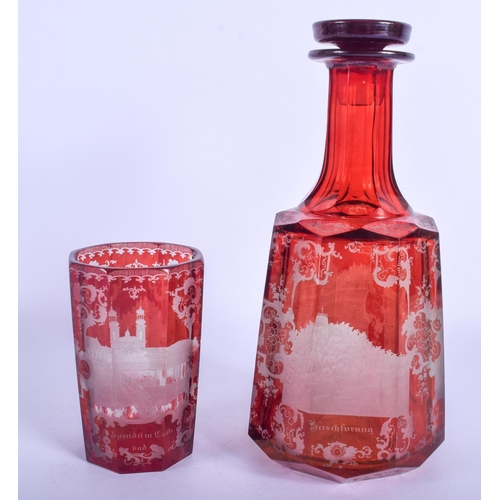 35 - A 19TH CENTURY BOHEMIAN RUBY GLASS DECANTER AND STOPPER together with a matching glass. Largest 24 c... 