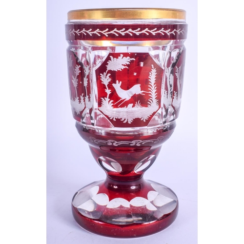 40 - AN ANTIQUE BOHEMIAN GLASS GOBLET decorated with birds. 15 cm high.