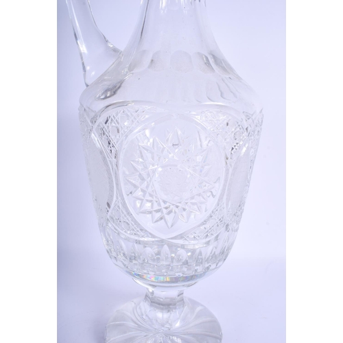 41 - A VERY LARGE CRYSTAL CUT GLASS DECANTER AND STOPPER decorated with star shaped motifs. 57 cm x 20 cm... 