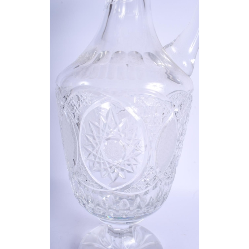 41 - A VERY LARGE CRYSTAL CUT GLASS DECANTER AND STOPPER decorated with star shaped motifs. 57 cm x 20 cm... 