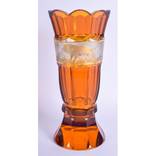 6 - AN ANTIQUE BOHEMIAN AMBER GLASS FLUTED GOBLET VASE possibly Moser, decorated with a banding of lions... 