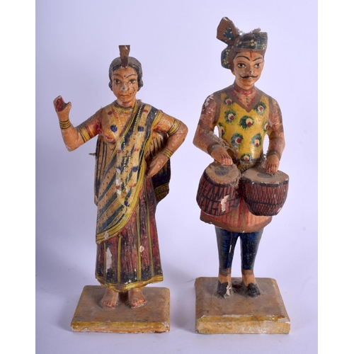 749 - A PAIR OF MIDDLE EASTERN ANTIQUE INDIAN RAJASTHAN PAINTED WOOD FIGURES. 20 cm high.