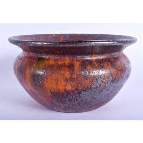 83 - AN EARLY 19TH CENTURY SCOTTISH TREACLE GLAZED BOWL of tortoiseshell style glaze. 14 cm wide.