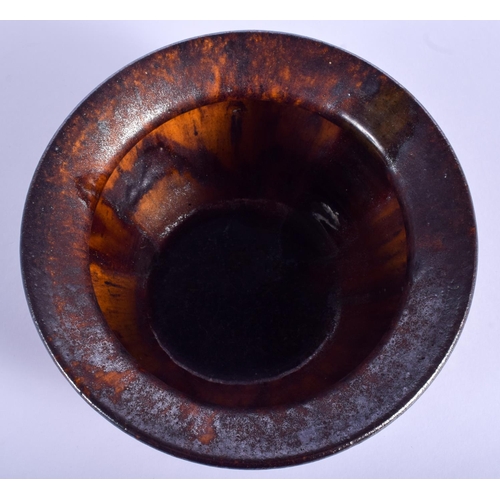 83 - AN EARLY 19TH CENTURY SCOTTISH TREACLE GLAZED BOWL of tortoiseshell style glaze. 14 cm wide.