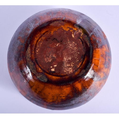 83 - AN EARLY 19TH CENTURY SCOTTISH TREACLE GLAZED BOWL of tortoiseshell style glaze. 14 cm wide.