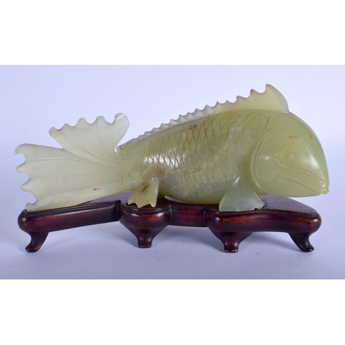 1296 - A LARGE EARLY 20TH CENTURY CHINESE CARVED JADE FIGURE OF A FISH Late Qing, modelled upon a fitted ha... 