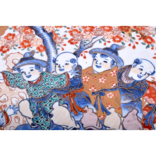 1322 - A VERY LARGE 19TH CENTURY JAPANESE MEIJI PERIOD IMARI CHARGER painted with boys within landscapes. 4... 