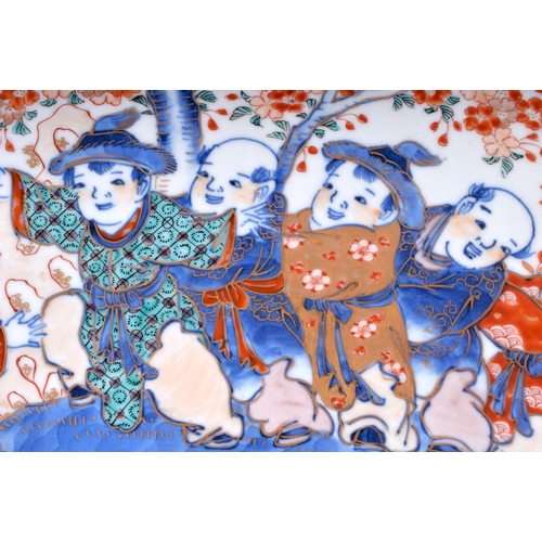 1322 - A VERY LARGE 19TH CENTURY JAPANESE MEIJI PERIOD IMARI CHARGER painted with boys within landscapes. 4... 