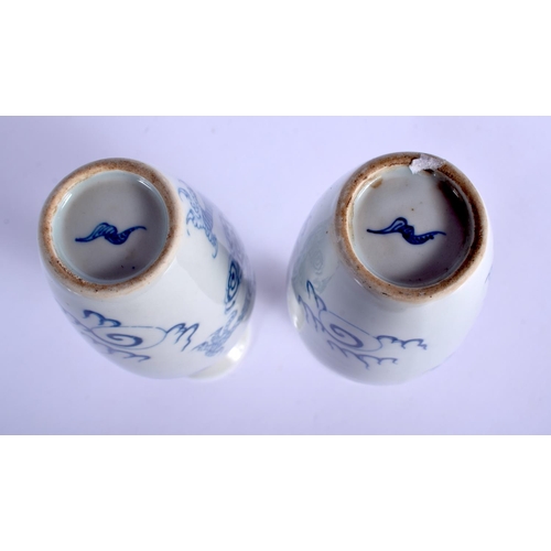 1324 - A PAIR OF CHINESE BLUE AND WHITE PORCELAIN VASES 20th Century, decorated with dragons amongst clouds... 