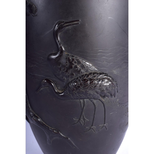 1437 - A GOOD LARGE 19TH CENTURY JAPANESE MEIJI PERIOD BRONZE VASE by Chikafusa, decorated in relief with c... 