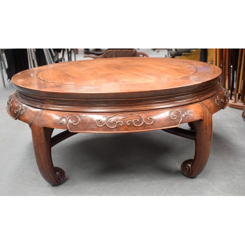 1438 - A VERY UNUSUAL 19TH CENTURY CHINESE HARDWOOD CIRCULAR LOW TABLE Qing, possibly Huanghuali, with curv... 