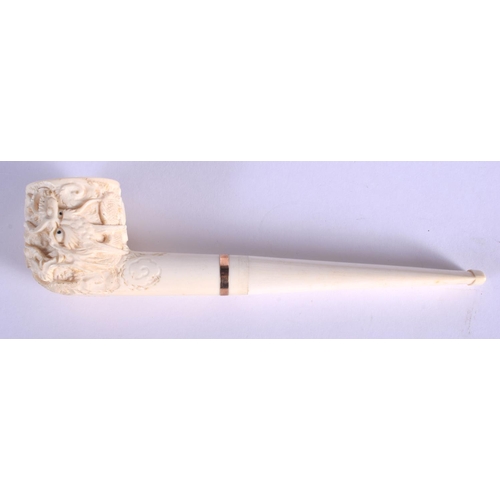 1639 - AN EARLY 20TH CHINESE CANTON IVORY PIPE Qing, modelled with a dragon terminal. 15 cm wide.