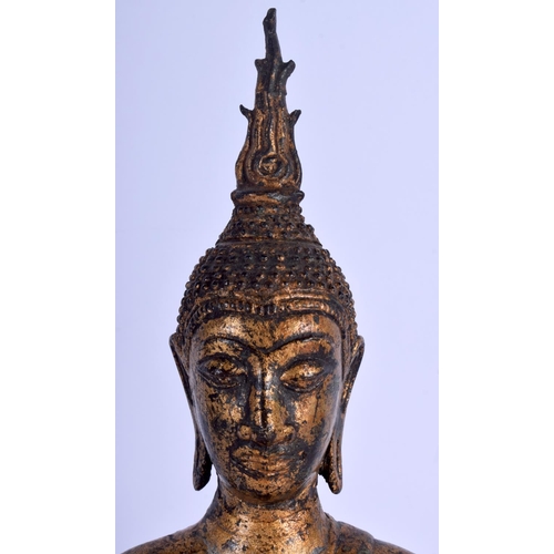 1643 - A 19TH CENTURY SOUTH EAST ASIAN THAI GILT BUDDHA modelled upon a triangular base. 30 cm x 12 cm.