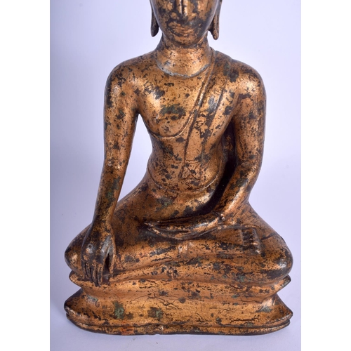 1643 - A 19TH CENTURY SOUTH EAST ASIAN THAI GILT BUDDHA modelled upon a triangular base. 30 cm x 12 cm.