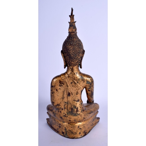 1643 - A 19TH CENTURY SOUTH EAST ASIAN THAI GILT BUDDHA modelled upon a triangular base. 30 cm x 12 cm.