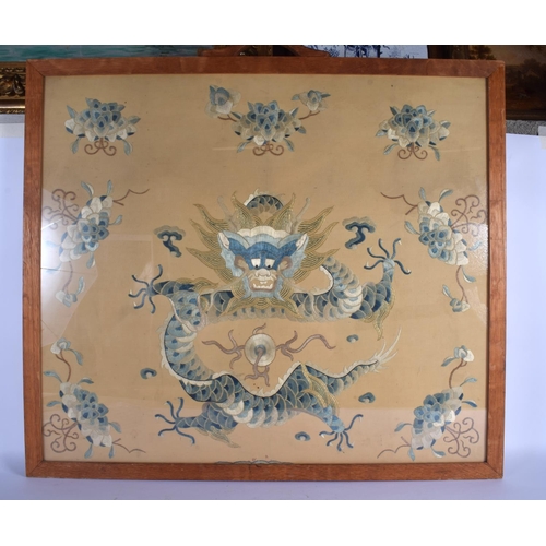 1650 - A LARGE 19TH CENTURY CHINESE SILK WORK EMBROIDERED PANEL Qing, decorated with a dragon amongst folia... 