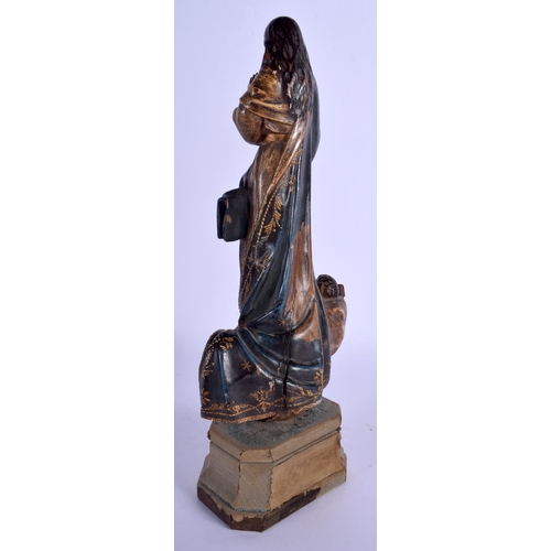 2352 - A LARGE 18TH CENTURY SOUTHERN EUROPEAN CARVED POLYCHROMED WOOD SAINT upon a velvet base. 33 cm high.