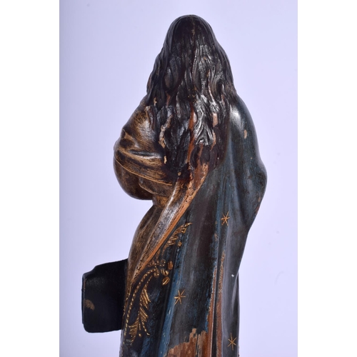 2352 - A LARGE 18TH CENTURY SOUTHERN EUROPEAN CARVED POLYCHROMED WOOD SAINT upon a velvet base. 33 cm high.