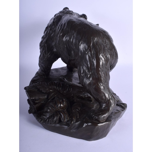 2354 - A LARGE 19TH CENTURY FRENCH BRONZE FIGURE OF A ROAMING BEAR modelled roaming upon a naturalistic out... 