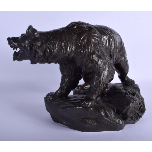 2354 - A LARGE 19TH CENTURY FRENCH BRONZE FIGURE OF A ROAMING BEAR modelled roaming upon a naturalistic out... 