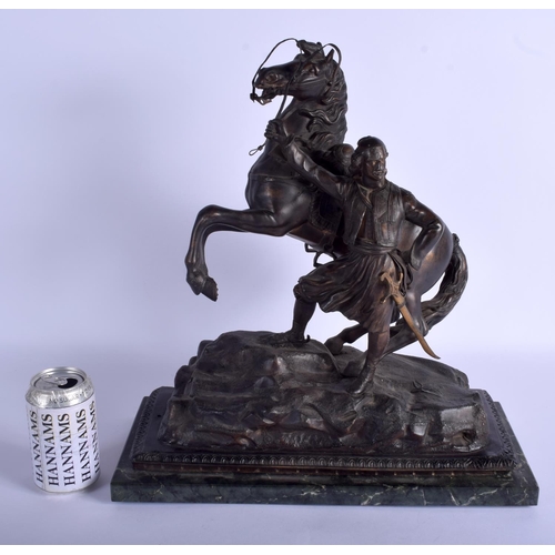 2355 - A LARGE 19TH CENTURY FRENCH SPELTER FIGURE OF A STANDING MALE modelled beside a rearing horse. 43 cm... 