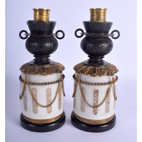 2358 - A RARE PAIR OF EARLY 19TH CENTURY FRENCH REVERSABLE CANDLESTICKS modelled upon marble plinths. 22 cm... 