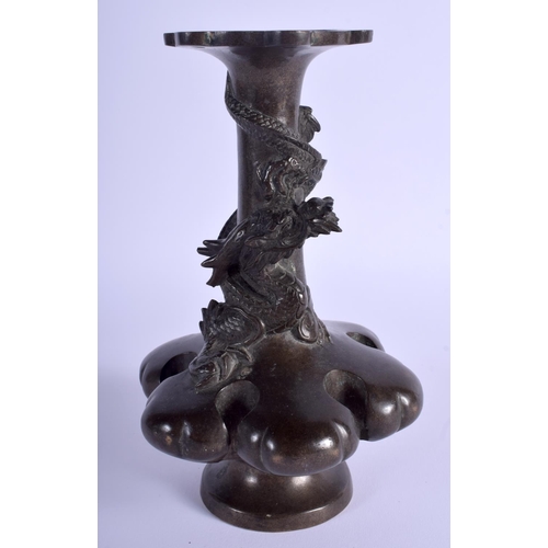 1001 - A 19TH CENTURY JAPANESE MEIJI PERIOD BRONZE LOBED VASE overlaid with an entwined dragon. 19 cm high.