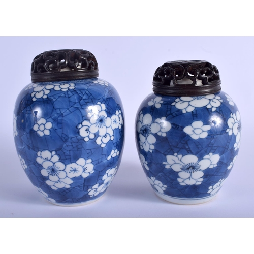 1008 - A NEAR PAIR OF 17TH CENTURY CHINESE BLUE AND WHITE GINGER JARS Kangxi, painted with prunus and flowe... 