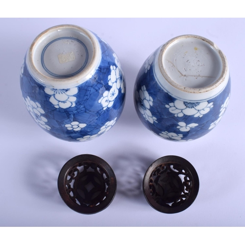 1008 - A NEAR PAIR OF 17TH CENTURY CHINESE BLUE AND WHITE GINGER JARS Kangxi, painted with prunus and flowe... 