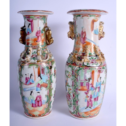 1021 - A NEAR PAIR OF 19TH CENTURY CHINESE CANTON FAMILLE ROSE VASES Qing. 26 cm high.