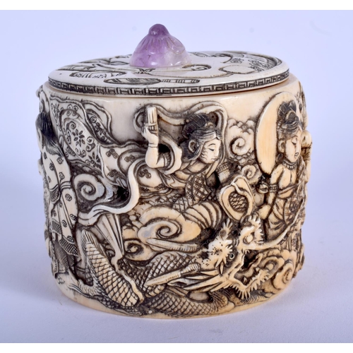 1028 - A 19TH CENTURY JAPANESE MEIJI PERIOD CARVED IVORY BOX AND COVER with amethyst finial, decorated with... 