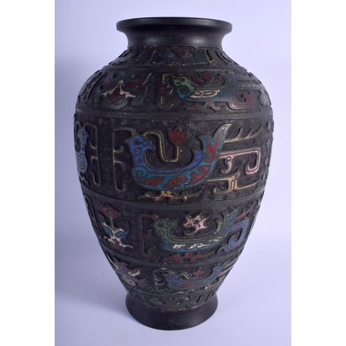 1042 - A LARGE 19TH CENTURY CHINESE CHAMPLEVE ENAMEL BRONZE VASE decorated with birds and taotie mask heads... 