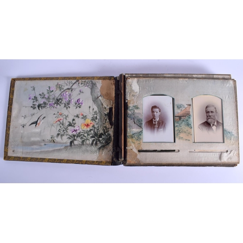 1046 - A LATE 19TH CENTURY JAPANESE MEIJI PERIOD BLACK LACQUER PHOTOGRAPH ALBUM decorated with figures. 35 ... 