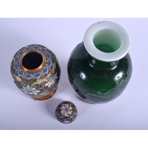 1056 - AN EARLY 20TH CENTURY CHINESE CLOISONNE ENAMEL VASE AND COVER together with a Peking style vase. Lar... 