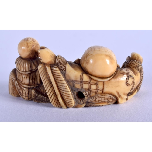 1067 - A 19TH CENTURY JAPANESE MEIJI PERIOD CARVED IVORY NETSUKE modelled as a buddha and boy. 5 cm x 2.5 c... 