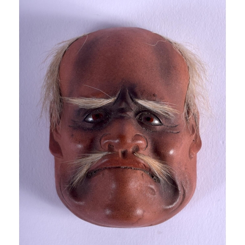 1085 - A 19TH CENTURY JAPANESE MEIJI PERIOD LACQUERED MINIATURE NOH MASK. 5.5 cm x 3.5 cm.