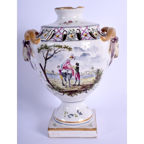 111 - AN 18TH CENTURY FRENCH FAIENCE POTTERY URN painted with figures and landscapes. 20 cm high.