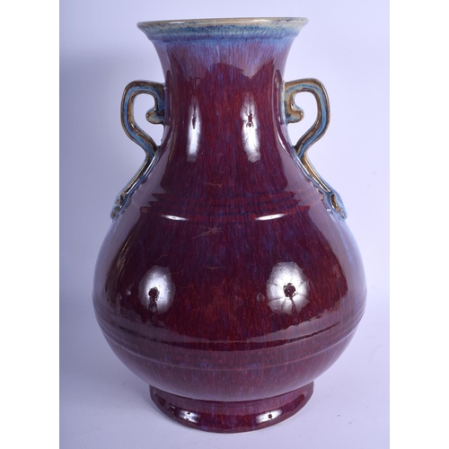 1117 - A LARGE 19TH CENTURY CHINESE FLAMBE GLAZED TWIN HANDLED VASE Qing, bearing Yongzheng marks to base. ... 