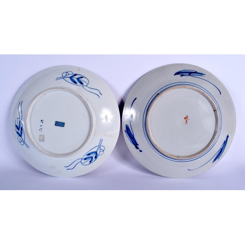 1125 - A LARGE PAIR OF 19TH CENTURY JAPANESE MEIJI PERIOD IMARI DISHES painted with foliage. 30 cm diameter... 