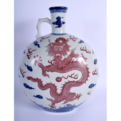 1145 - A LARGE CHINESE BLUE AND WHITE PORCELAIN MOON FLASK 20th Century, bearing Qianlong marks to base, pa... 