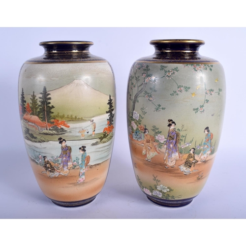 1152 - A LARGE PAIR OF 19TH CENTURY JAPANESE MEIJI PERIOD SATSUMA VASES painted with geisha within landscap... 