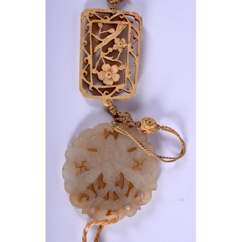 1176 - A 19TH CENTURY CHINESE CARVED JADE AND IVORY PENDANT Qing, carved as a butterfly amongst foliage. Ja... 