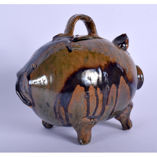 121 - A 19TH CENTURY STAFFORDSHIRE TREACLE GLAZED WHIELDON TYPE MONEY BOX in the form of a pig. 13.5 cm wi... 