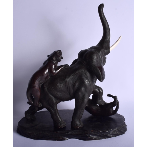 1220 - A 19TH CENTURY JAPANESE MEIJI PERIOD BRONZE OKIMONO modelled as two tigers attacking an elephant. 27... 