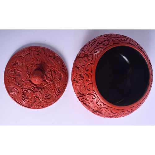 1228 - AN EARLY 20TH CENTURY CHINESE CARVED RED LACQUER BOX AND COVER possibly cinnabar, decorated with dra... 